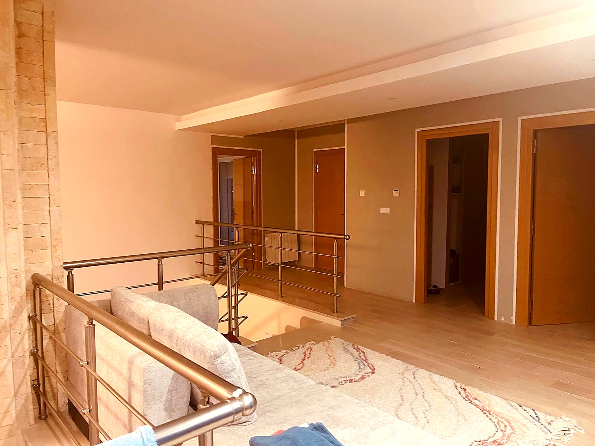 Mezzanine sitting area opening onto the upstairs bedrooms