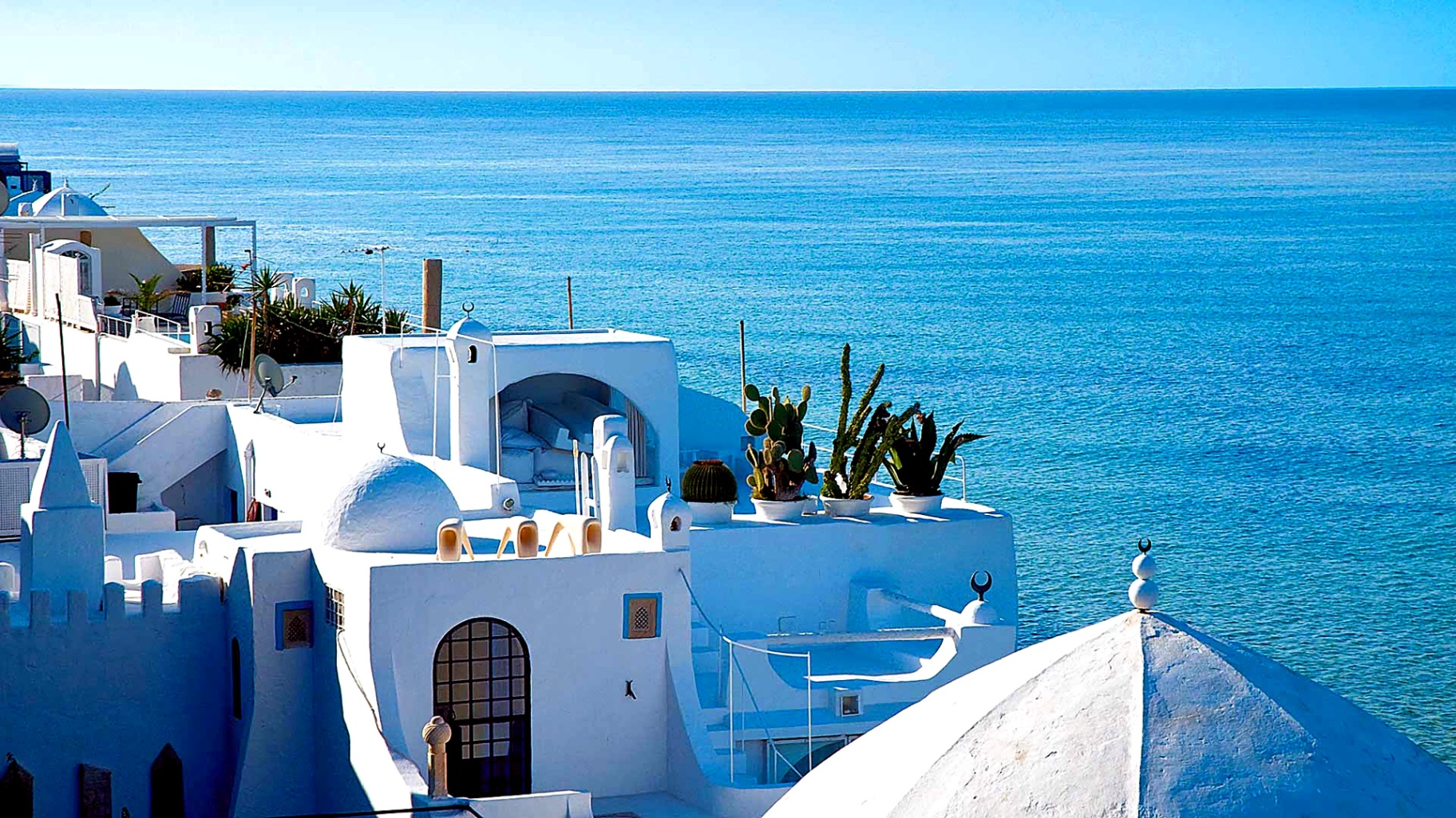 White Mediterranean rooftops overlooking the blue sea