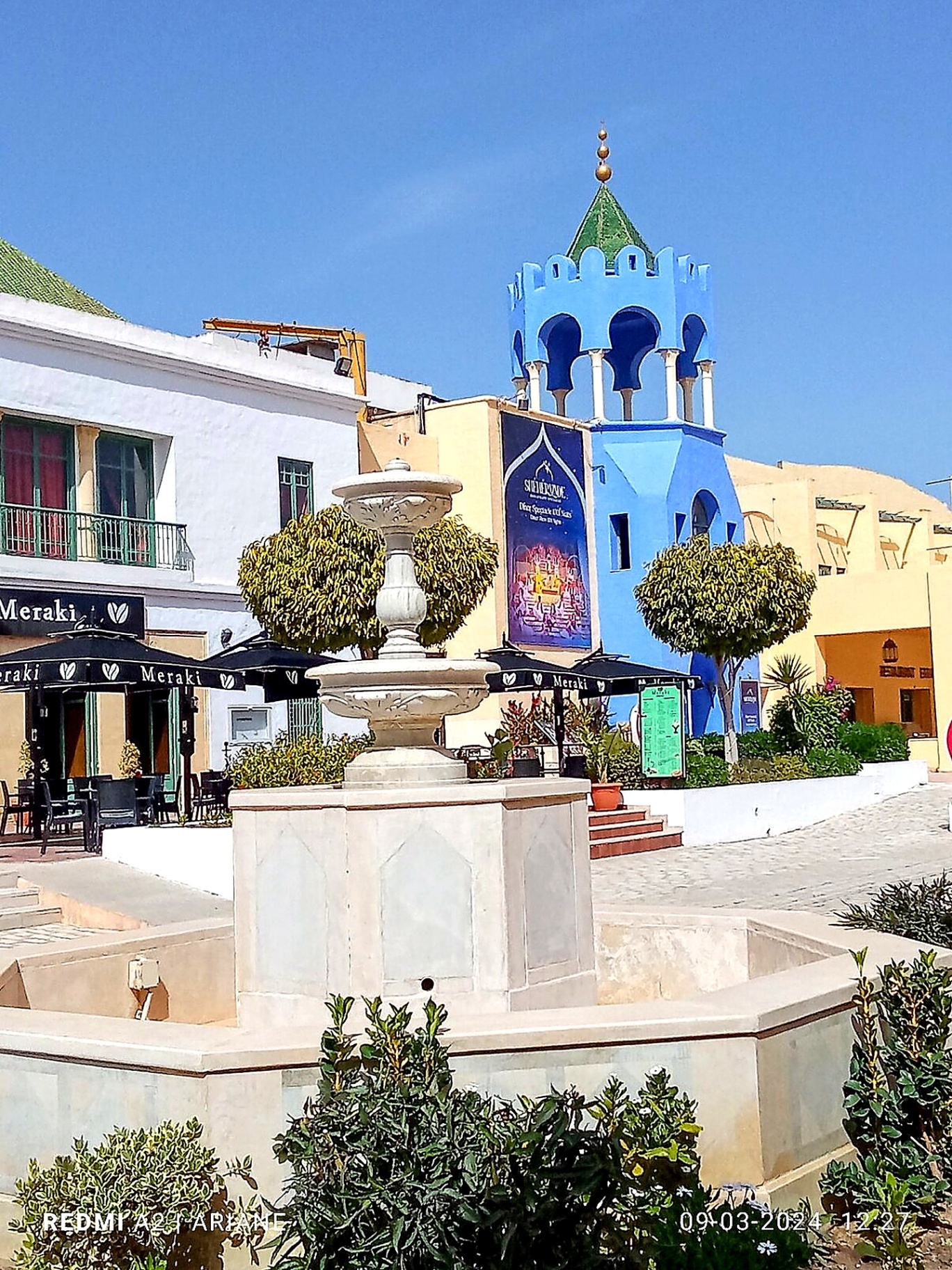 Fountain and blue tower in Yasmine Hammamet medina
