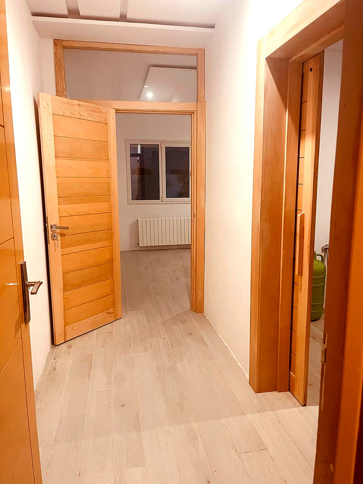 Hallway with solid oak doors and light oak flooring