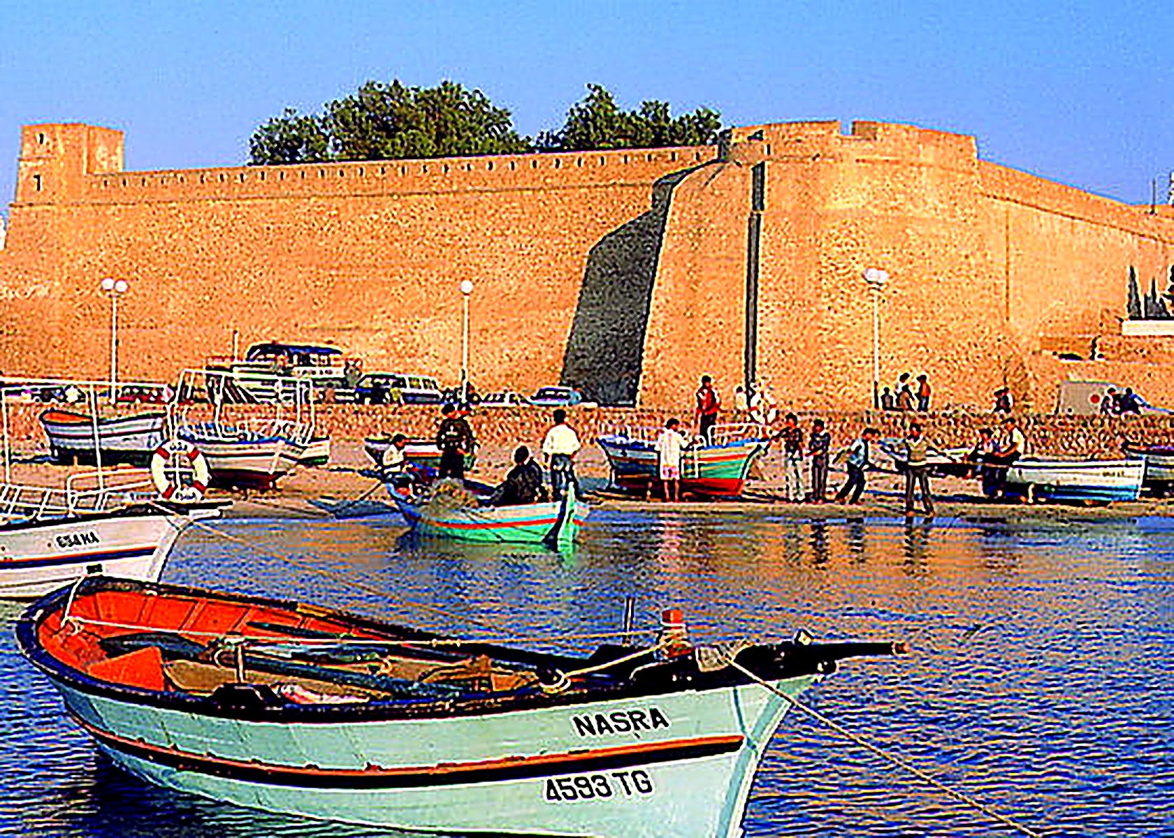 Fishing boats in front of the historic kasbah walls