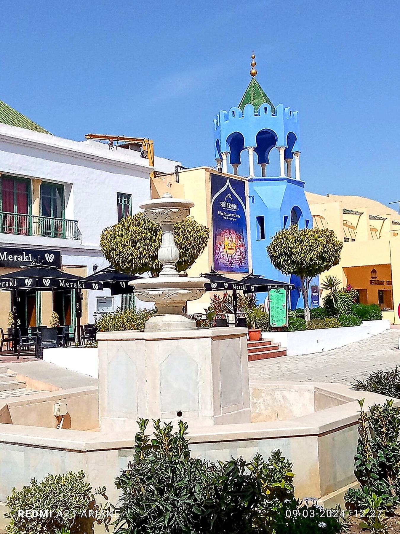 Fountain and blue tower in Yasmine Hammamet medina