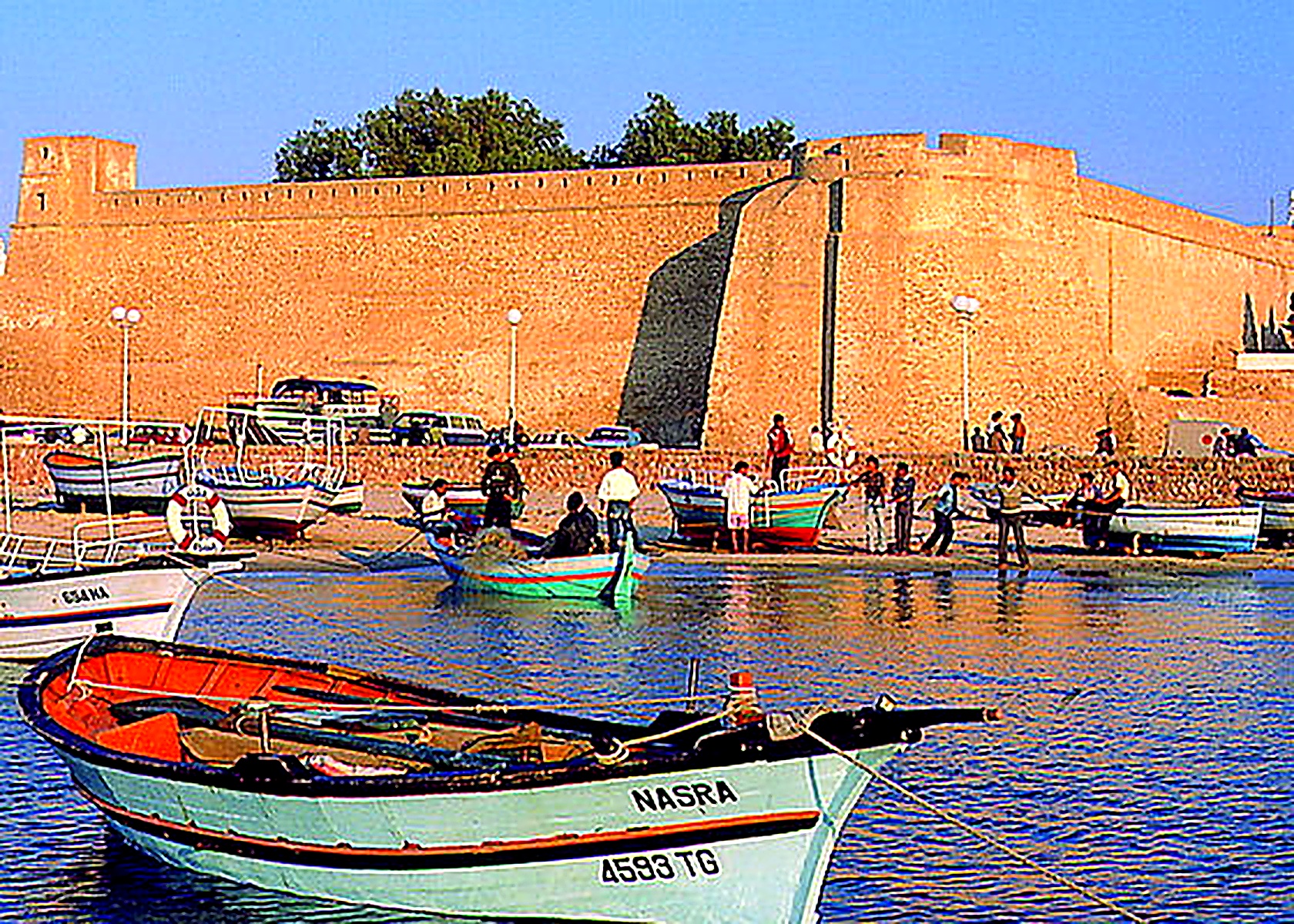 Fishing boats in front of the historic kasbah walls